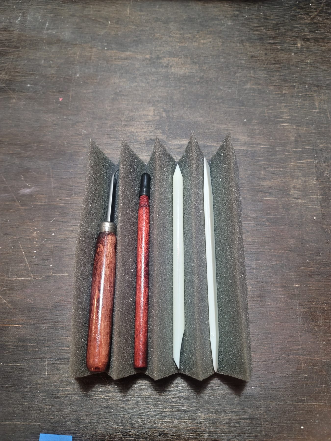 Hand tools used to shape and work aluminum mosaic surfaces